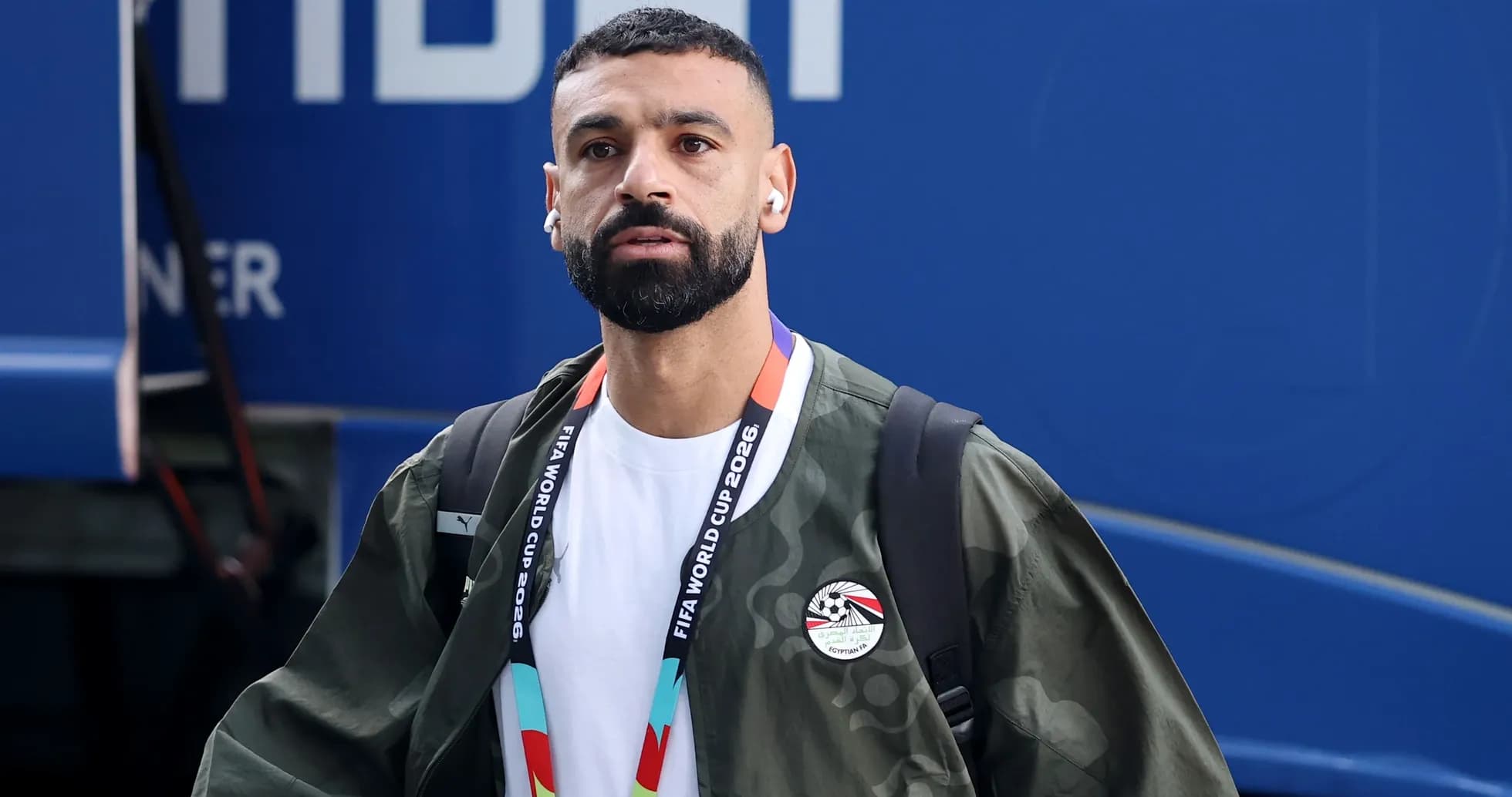 Player arriving with earphones and FIFA lanyard Player arriving with earphones and FIFA lanyard