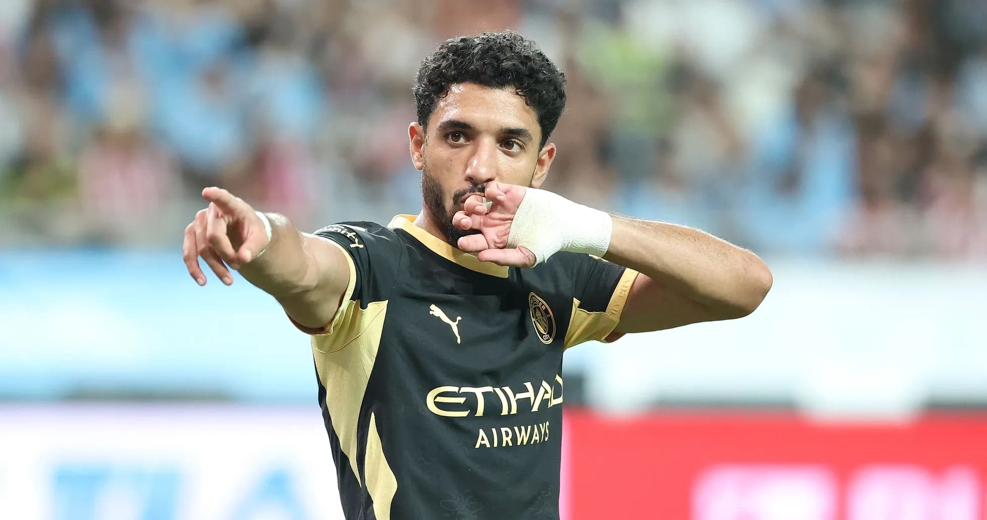Player gesturing during a football match celebration Player gesturing during a football match celebration