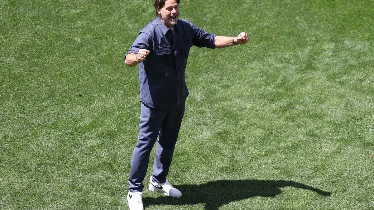 Coach celebrating on the field during a match Coach celebrating on the field during a match