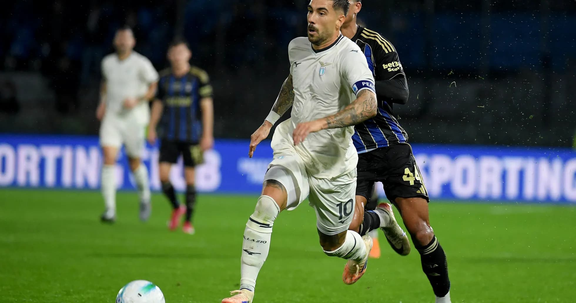 Lazio player dribbling past Pisa defender Lazio player dribbling past Pisa defender