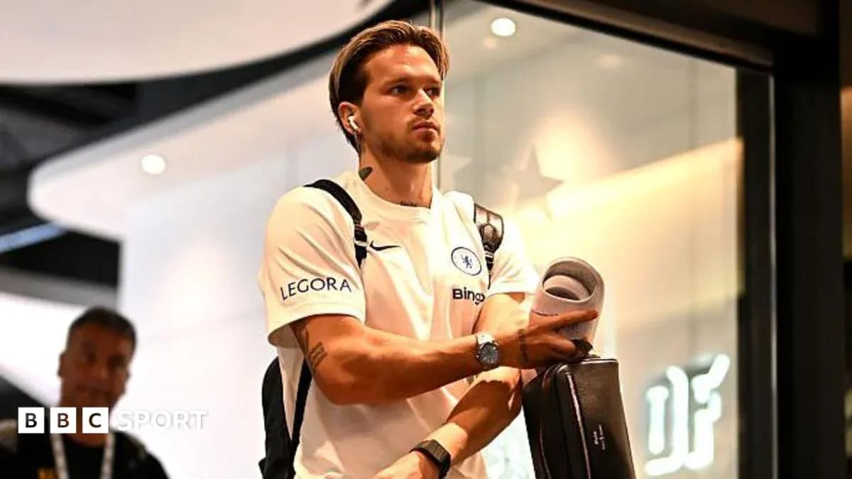 Player arriving at venue with headphones and bag Player arriving at venue with headphones and bag