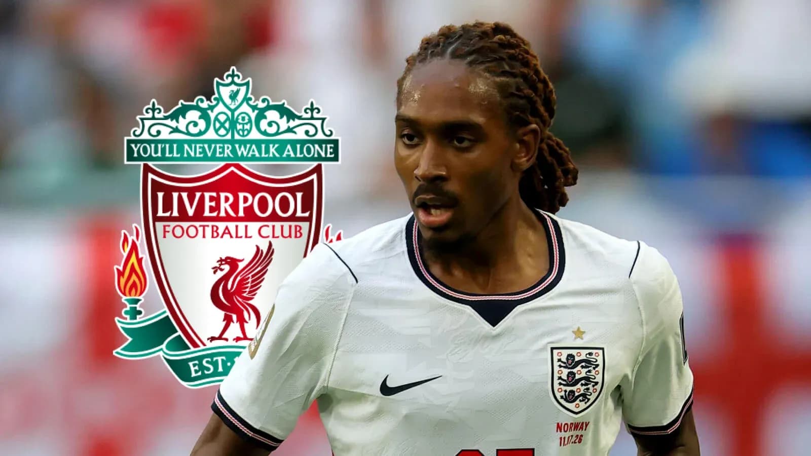 Player running with ball, Liverpool logo in background Player running with ball, Liverpool logo in background