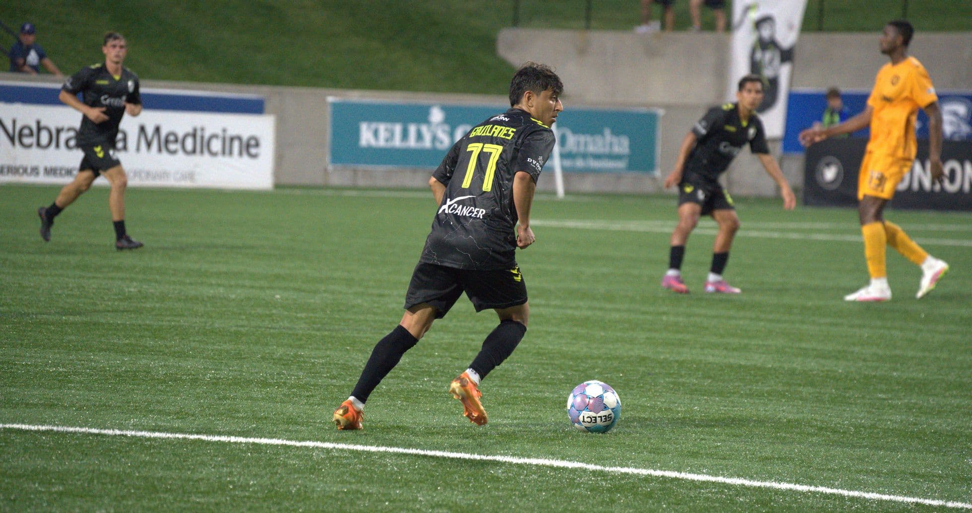Player dribbling the ball during match Player dribbling the ball during match