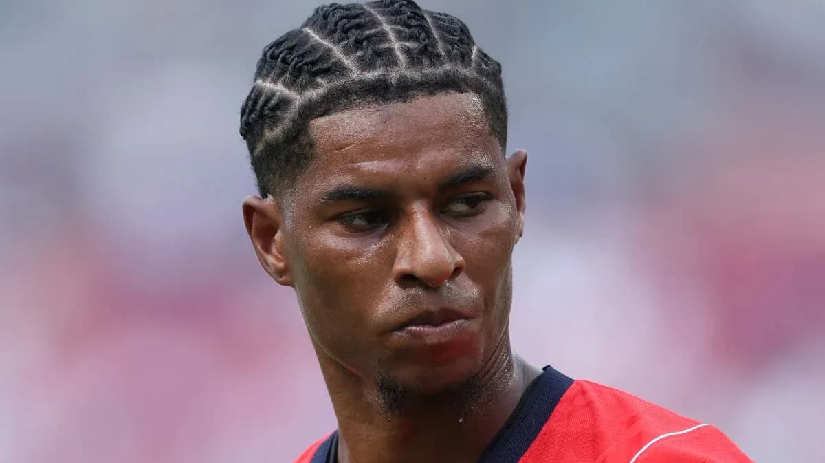 Player with braided hairstyle in red jersey Player with braided hairstyle in red jersey