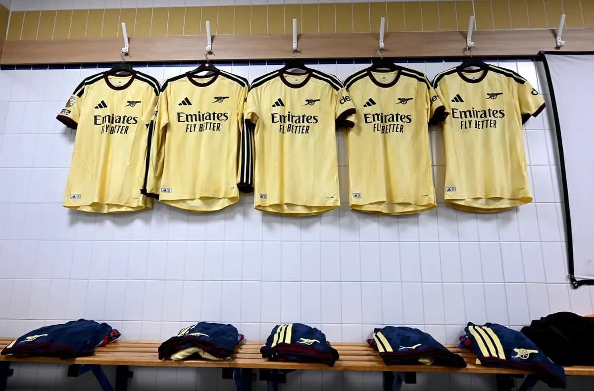Arsenal jerseys hanging in a locker room Arsenal jerseys hanging in a locker room