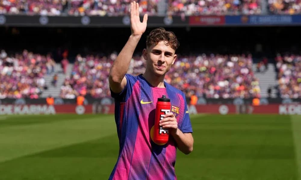 Player waving with water bottle at stadium Player waving with water bottle at stadium