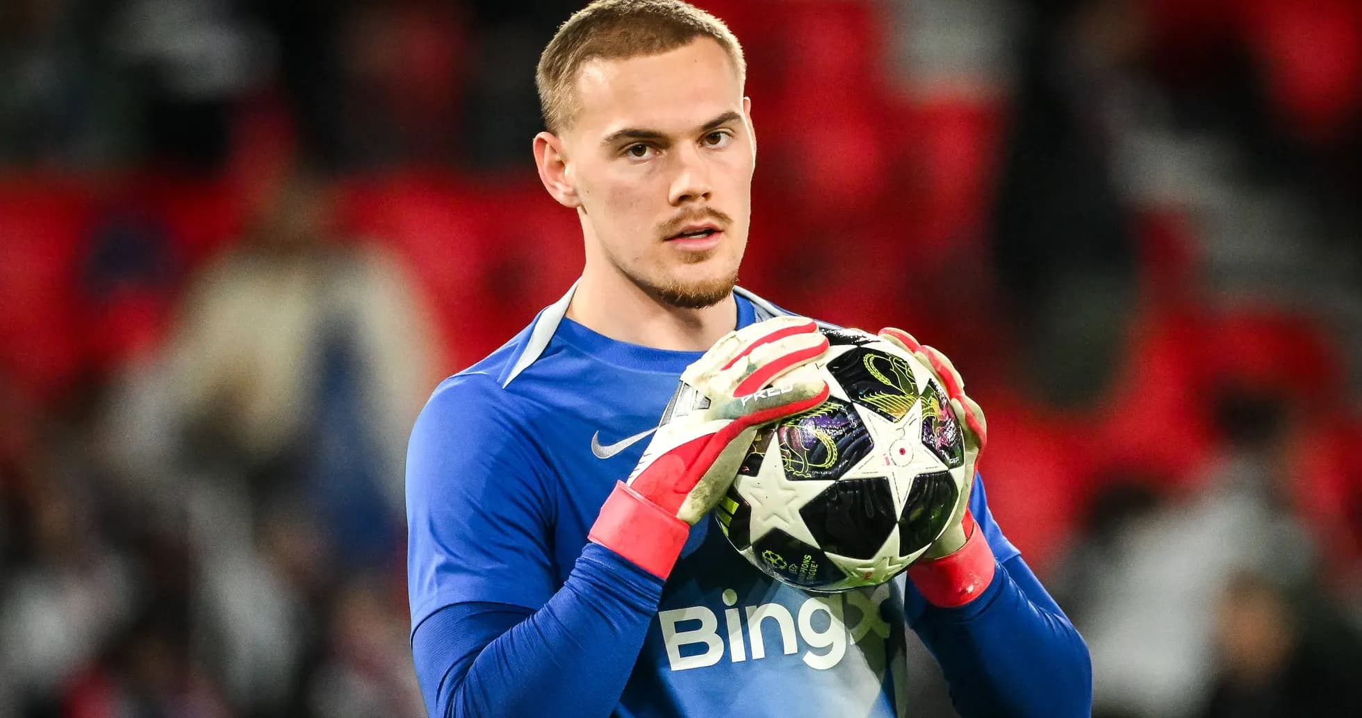Goalkeeper holding ball during match warm-up Goalkeeper holding ball during match warm-up