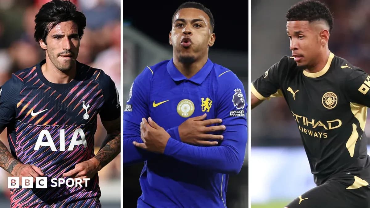 Three football players in team kits during match Three football players in team kits during match