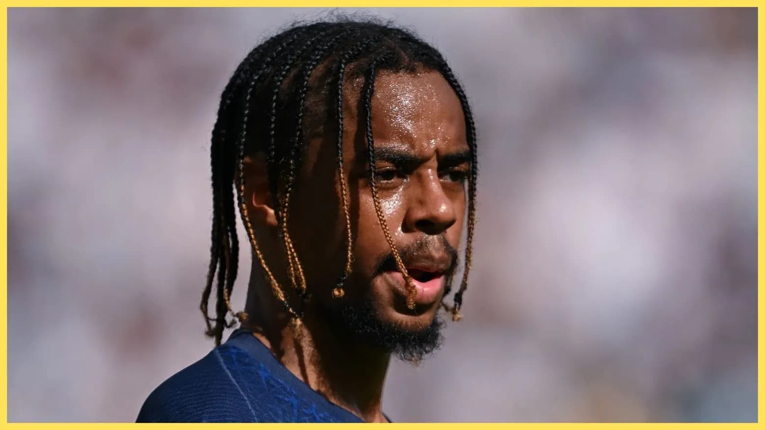 Player with braided hair during a match Player with braided hair during a match