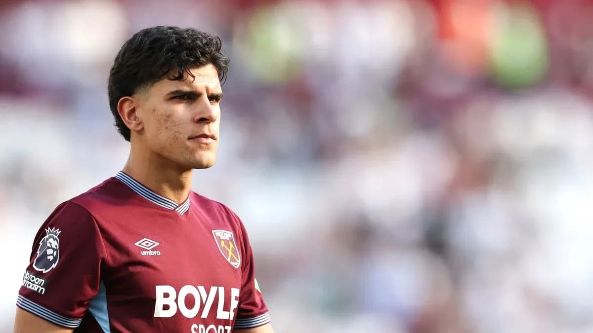 Player in West Ham United kit on the pitch Player in West Ham United kit on the pitch