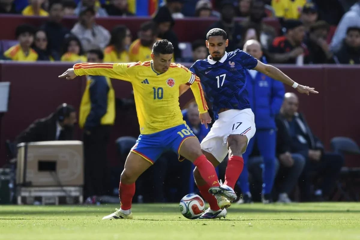 Colombian and French players competing for the ball Colombian and French players competing for the ball
