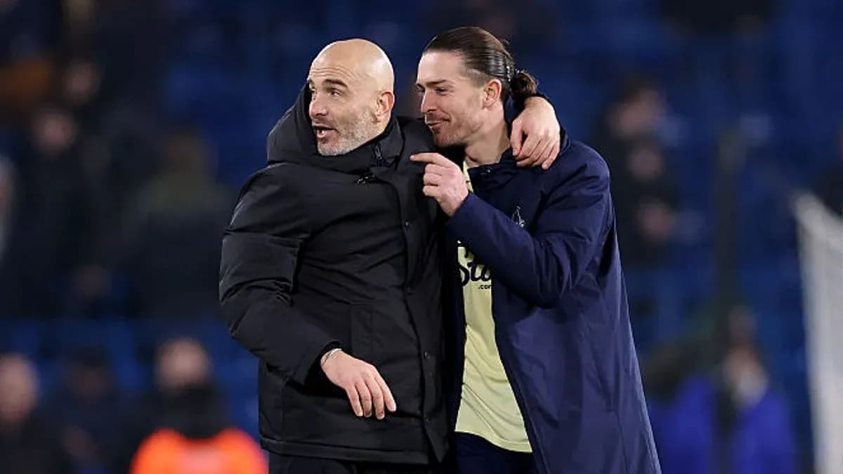 Coach and player celebrating on the field Coach and player celebrating on the field