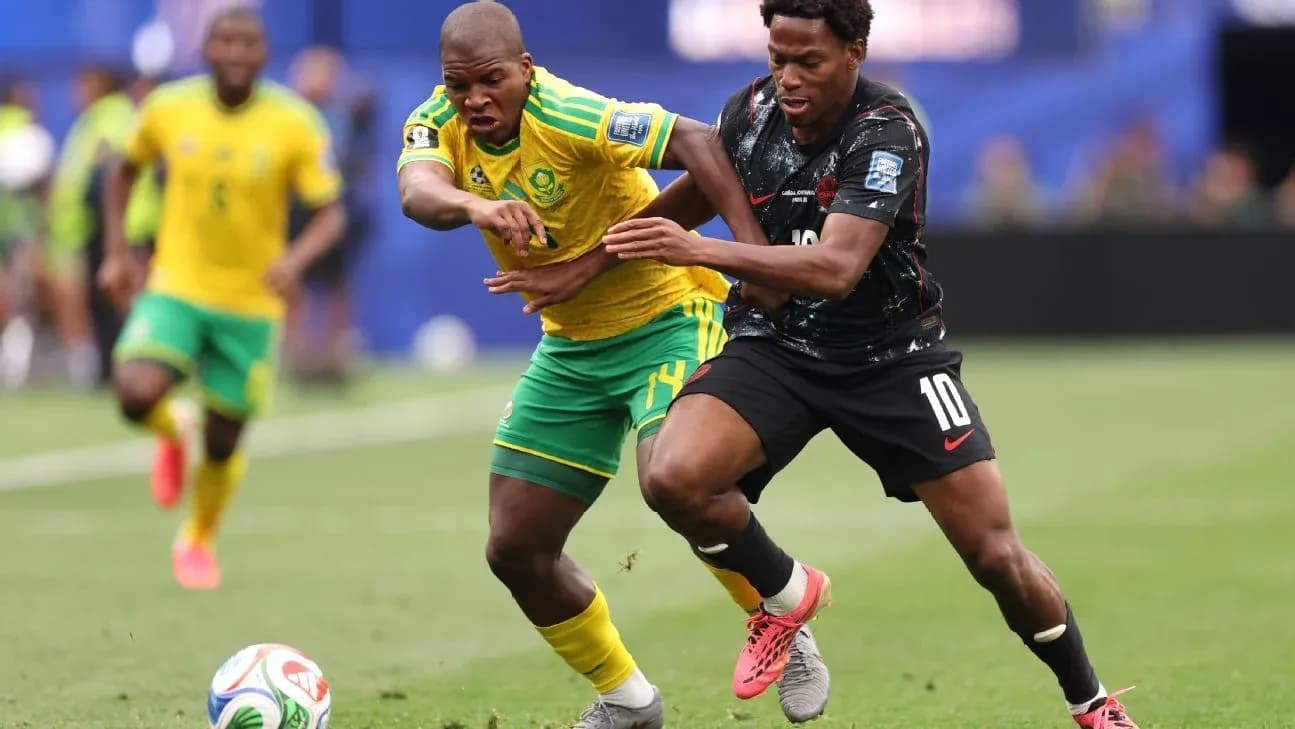 Two players competing for the ball during match Two players competing for the ball during match