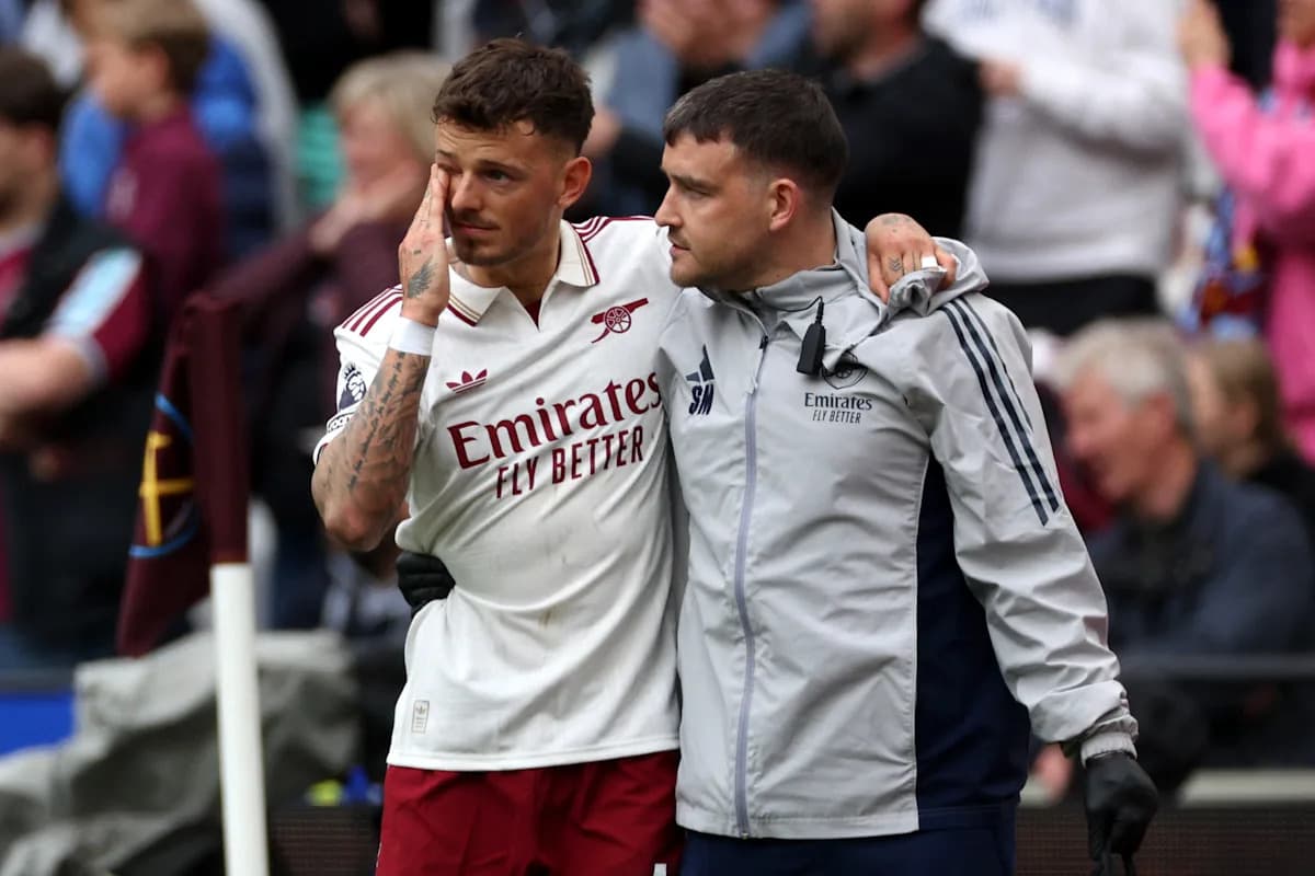Player being supported by staff after match Player being supported by staff after match
