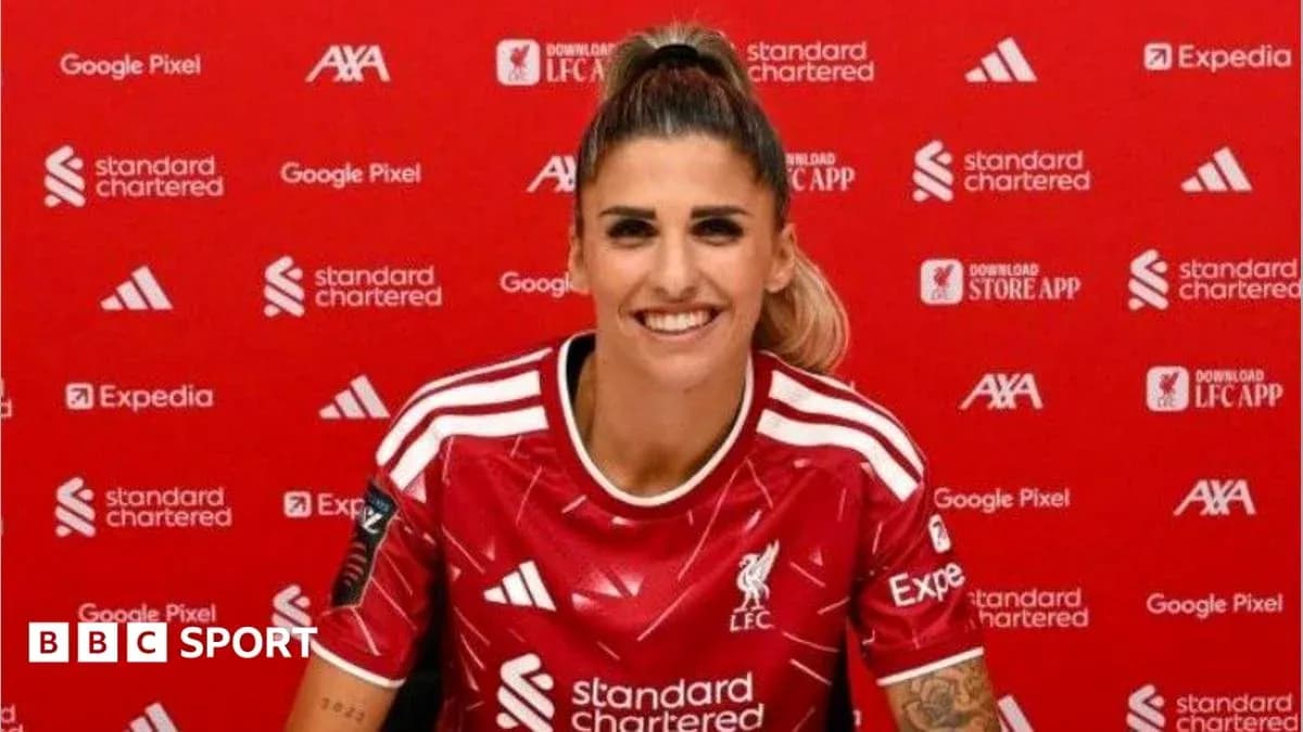 Player in Liverpool jersey at press conference Player in Liverpool jersey at press conference