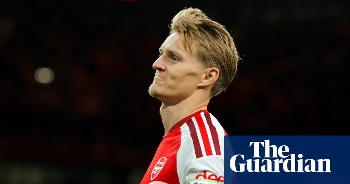 Arsenal player looking thoughtful on the field Arsenal player looking thoughtful on the field