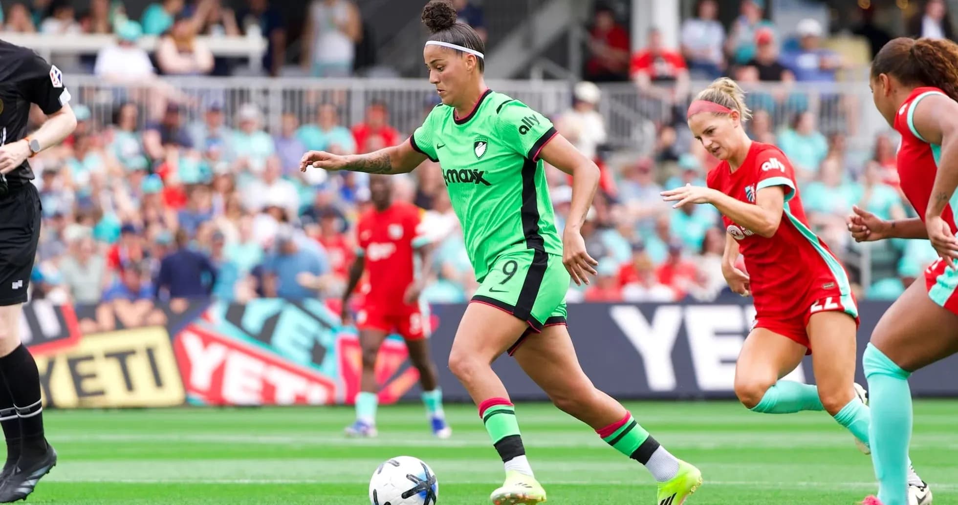 Player dribbling the ball during NWSL match Player dribbling the ball during NWSL match