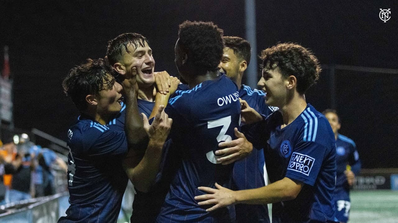 Players celebrating a goal during match Players celebrating a goal during match