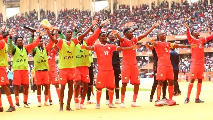 Players celebrating in front of cheering crowd Players celebrating in front of cheering crowd