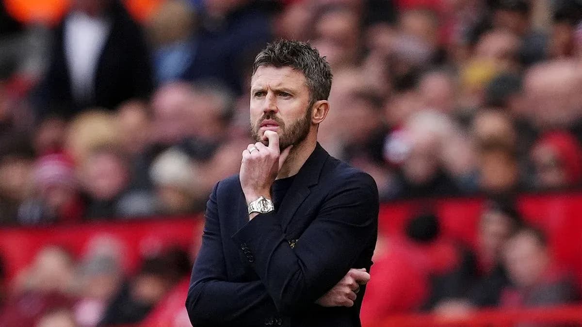 Manager contemplating during a match on the sideline Manager contemplating during a match on the sideline