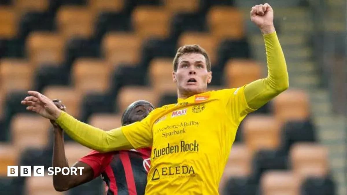Player jumping for a header during a match Player jumping for a header during a match