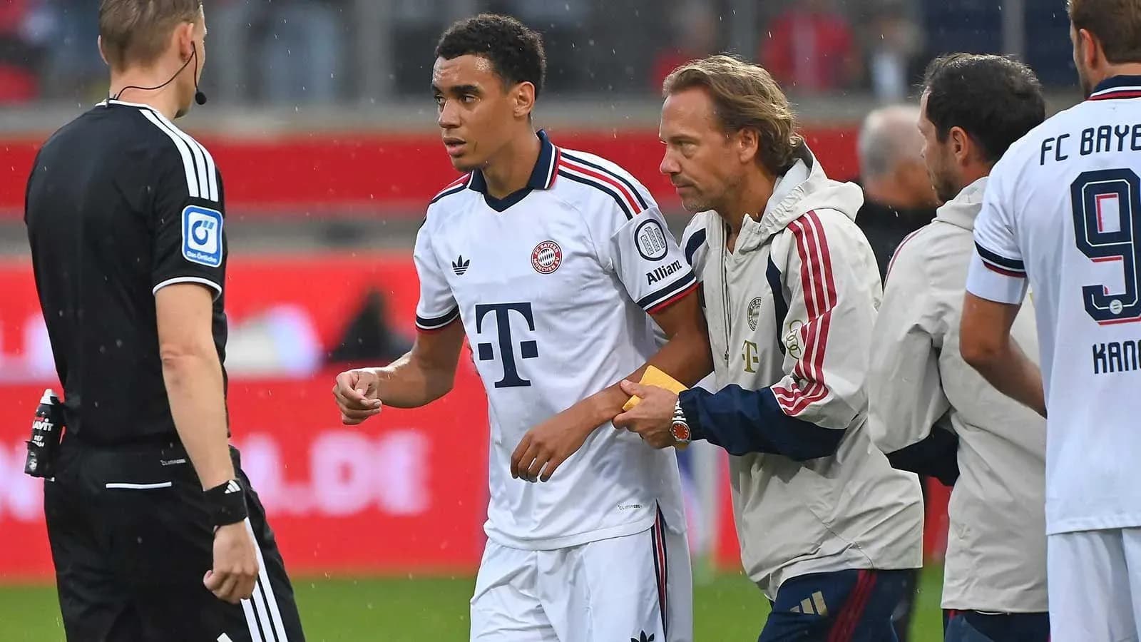 Bayern Munich player receiving medical attention on field Bayern Munich player receiving medical attention on field
