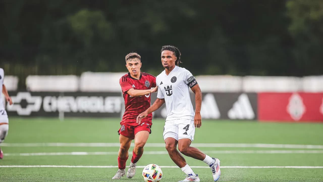 Inter Miami II player dribbling past Toronto II opponent Inter Miami II player dribbling past Toronto II opponent