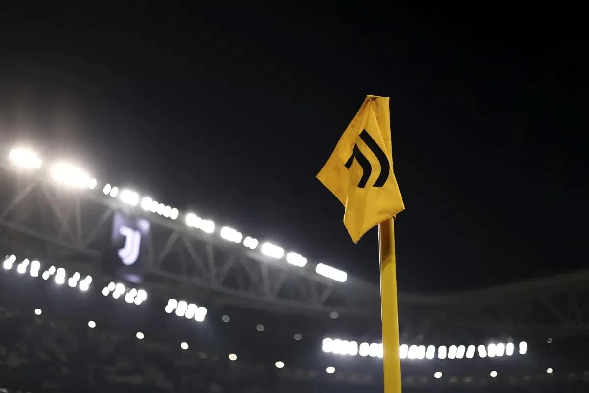 Yellow corner flag with Juventus logo in background Yellow corner flag with Juventus logo in background