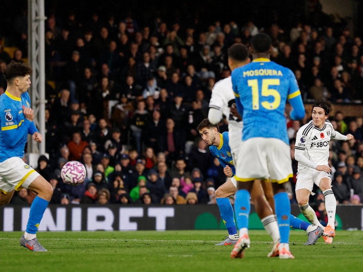 Fulham player shoots during Wolves match Fulham player shoots during Wolves match
