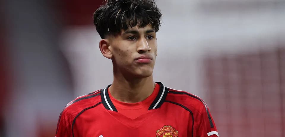 Player in Manchester United kit during match Player in Manchester United kit during match