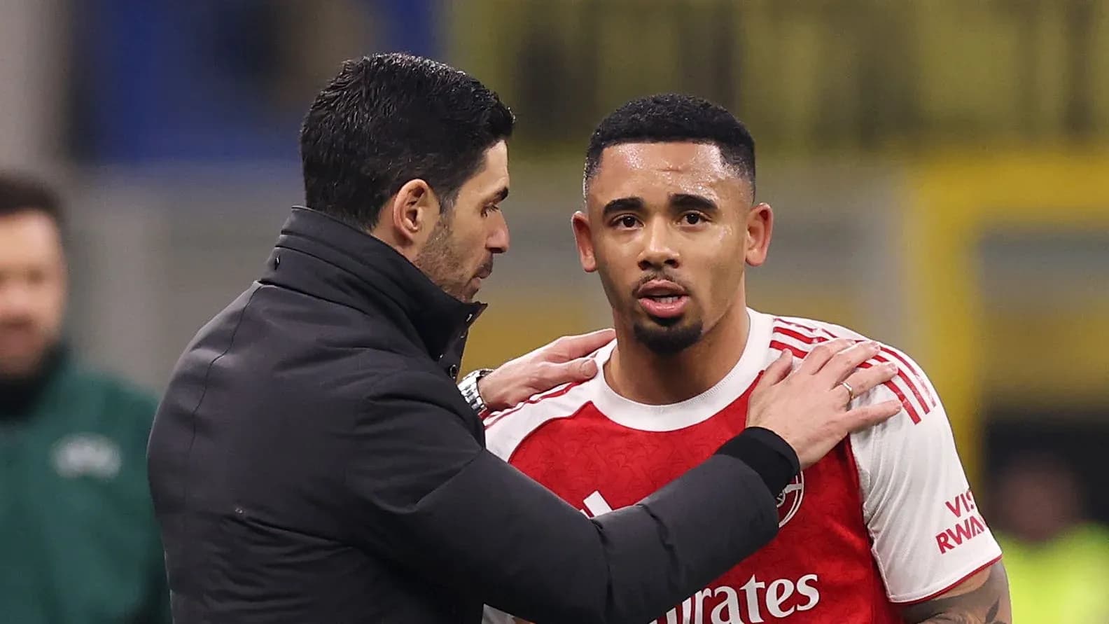 Coach talking to player during match substitution Coach talking to player during match substitution