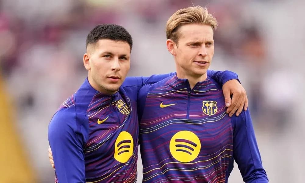 Two players in FC Barcelona training kits posing together Two players in FC Barcelona training kits posing together