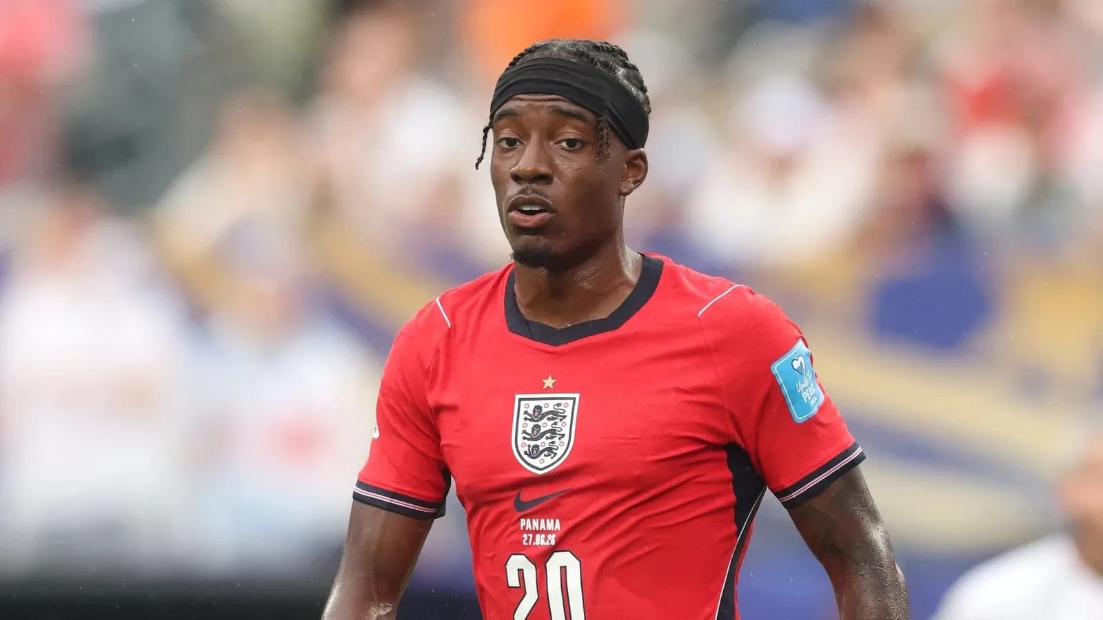 Player in red England jersey during match Player in red England jersey during match
