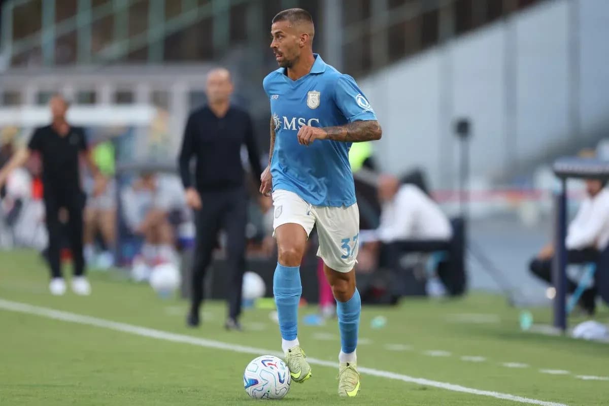 Player in blue jersey dribbling a soccer ball Player in blue jersey dribbling a soccer ball