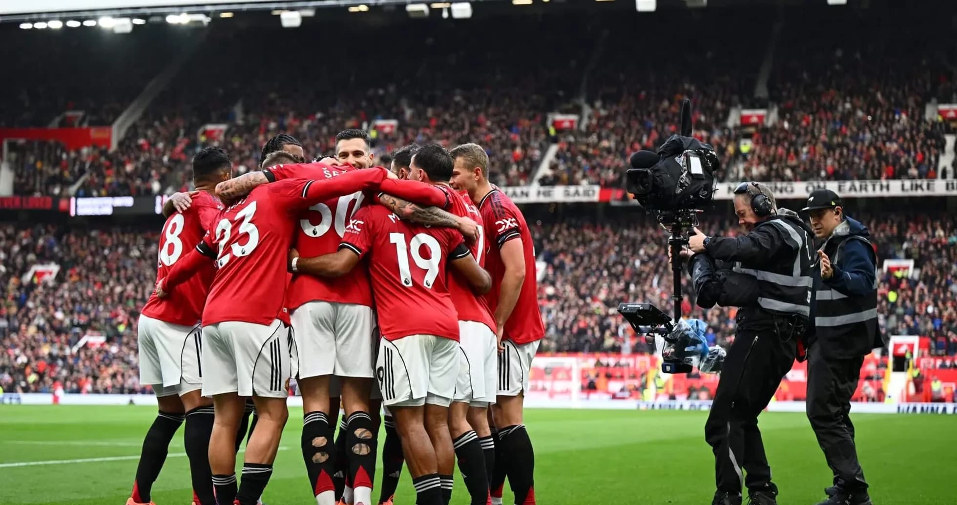 Manchester United players celebrating a goal Manchester United players celebrating a goal