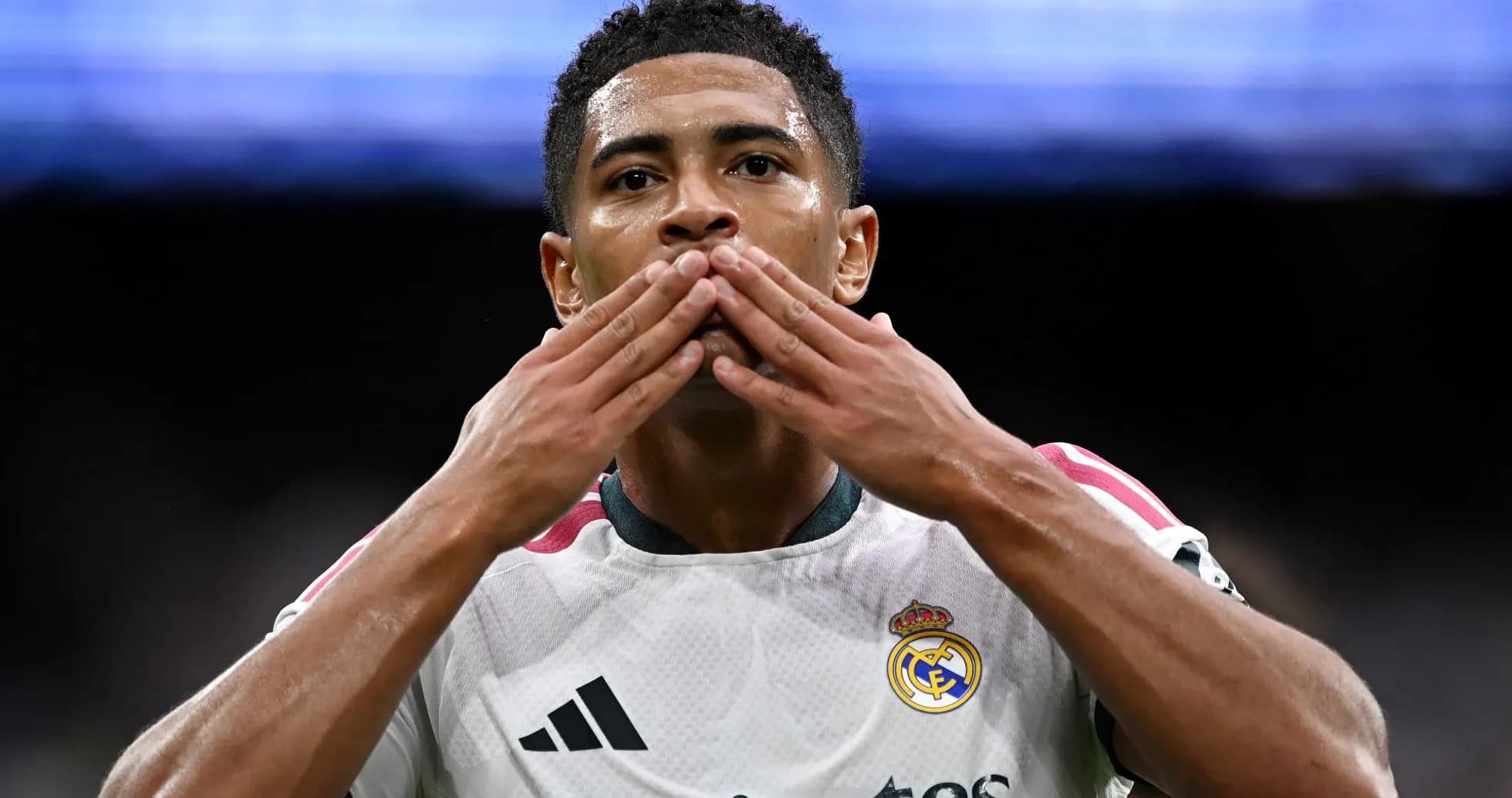 Player celebrating with hand gestures on the field Player celebrating with hand gestures on the field