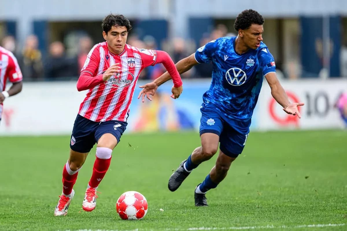 HFX Wanderers FC player dribbling against Atlético Ottawa HFX Wanderers FC player dribbling against Atlético Ottawa