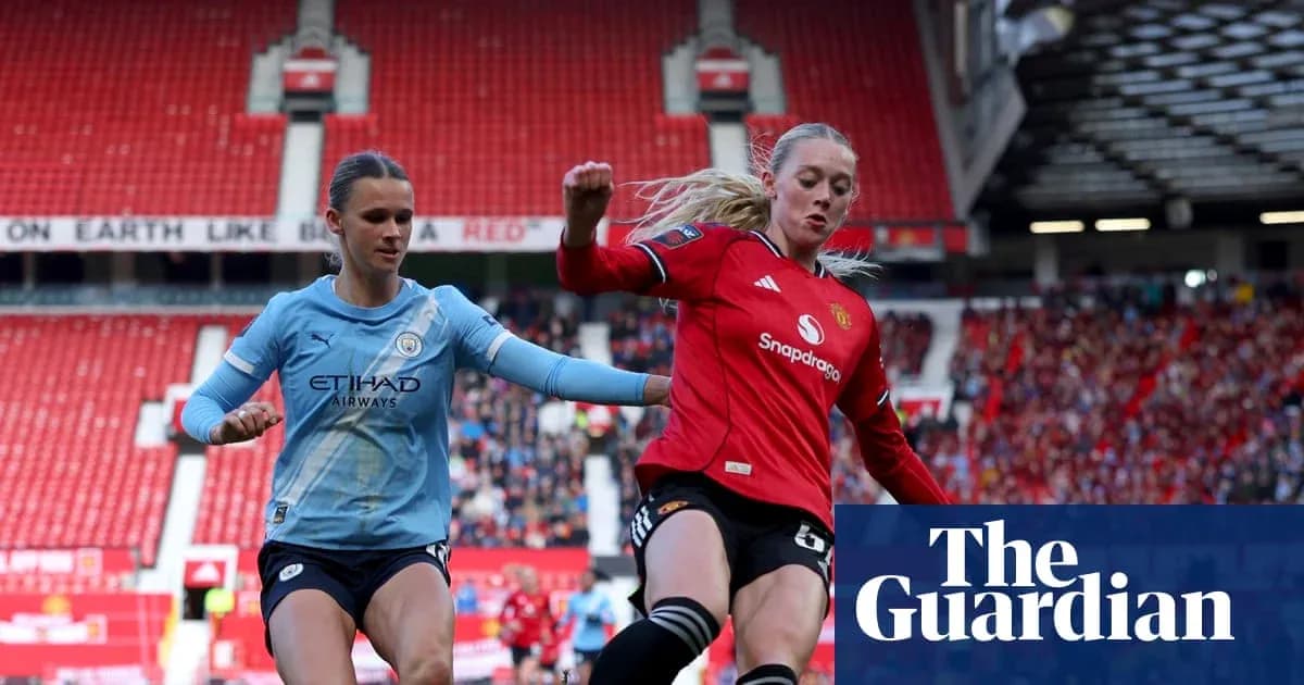 Players from Manchester City and Manchester United contesting the ball Players from Manchester City and Manchester United contesting the ball