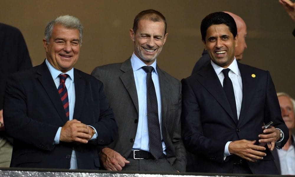 Three officials smiling in a stadium box Three officials smiling in a stadium box