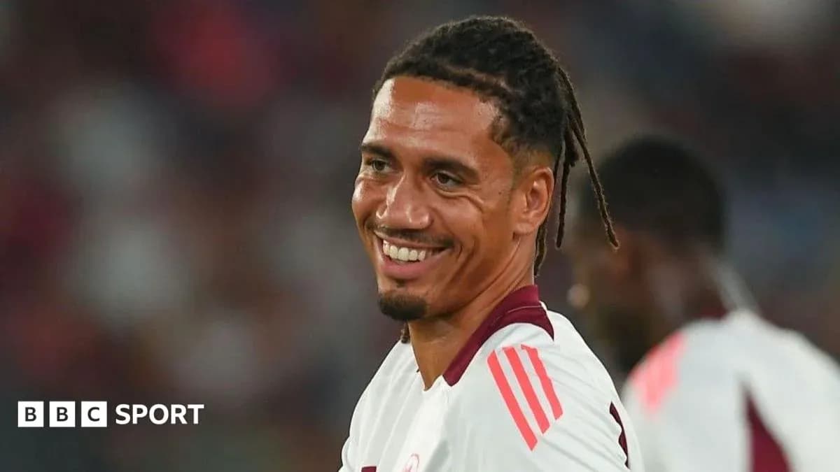 Player smiling during a match on the field Player smiling during a match on the field