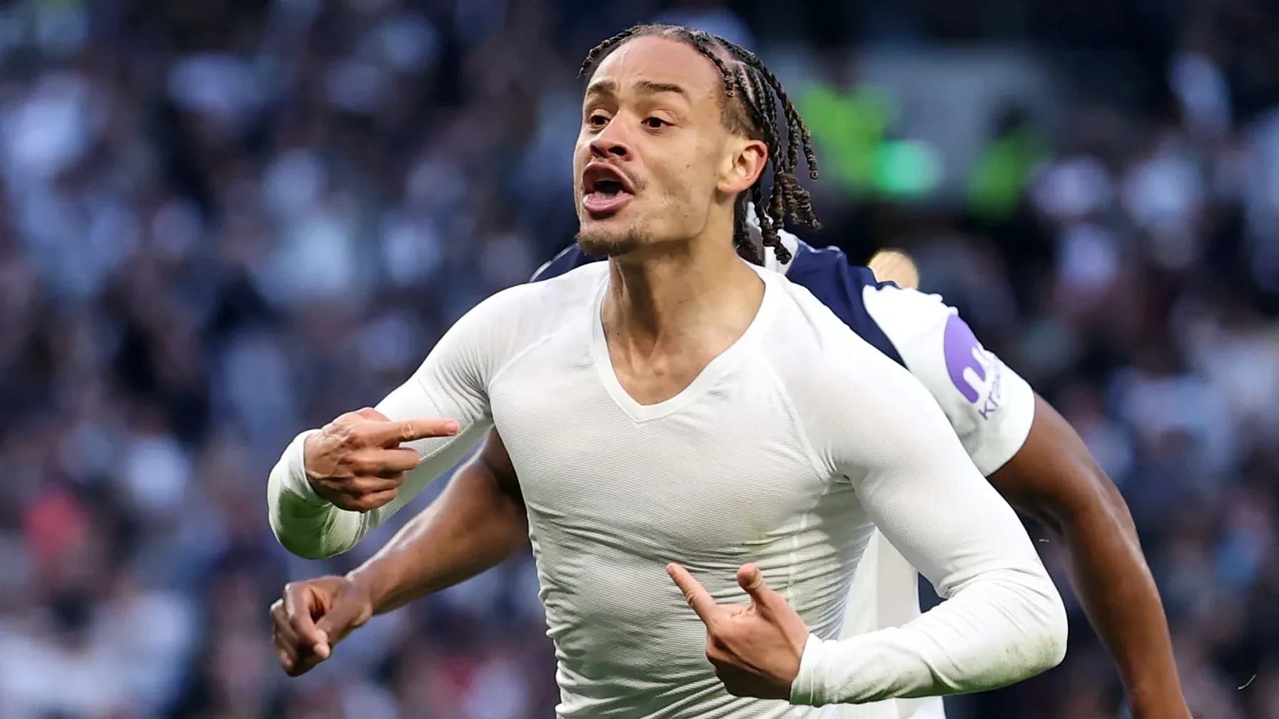 Player celebrating a goal with enthusiastic gestures Player celebrating a goal with enthusiastic gestures