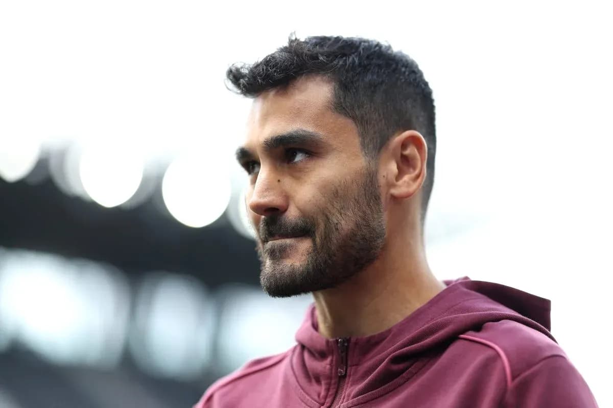 Player wearing maroon hoodie at stadium entrance Player wearing maroon hoodie at stadium entrance