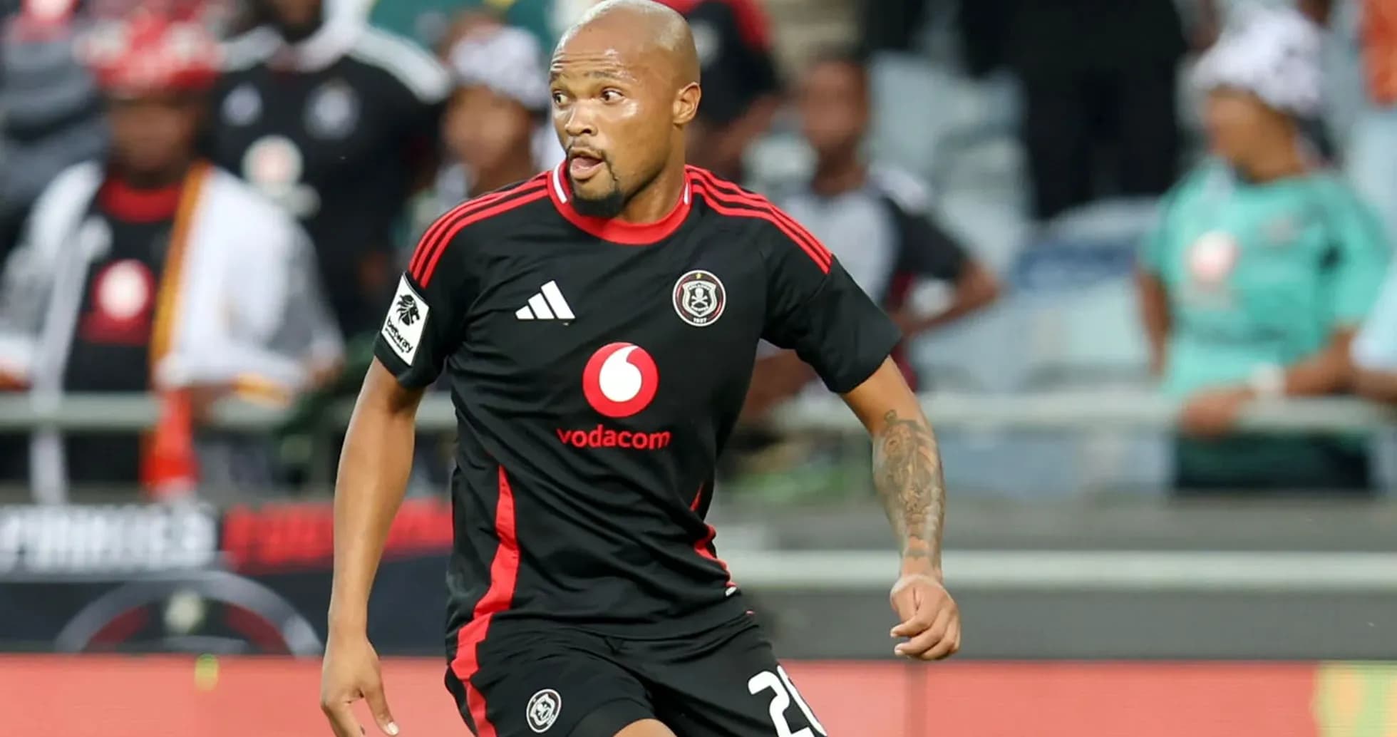 Player wearing black jersey running on the field Player wearing black jersey running on the field