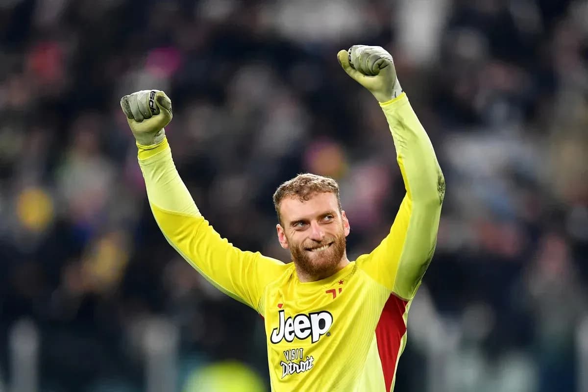 Goalkeeper celebrating victory with raised fists Goalkeeper celebrating victory with raised fists
