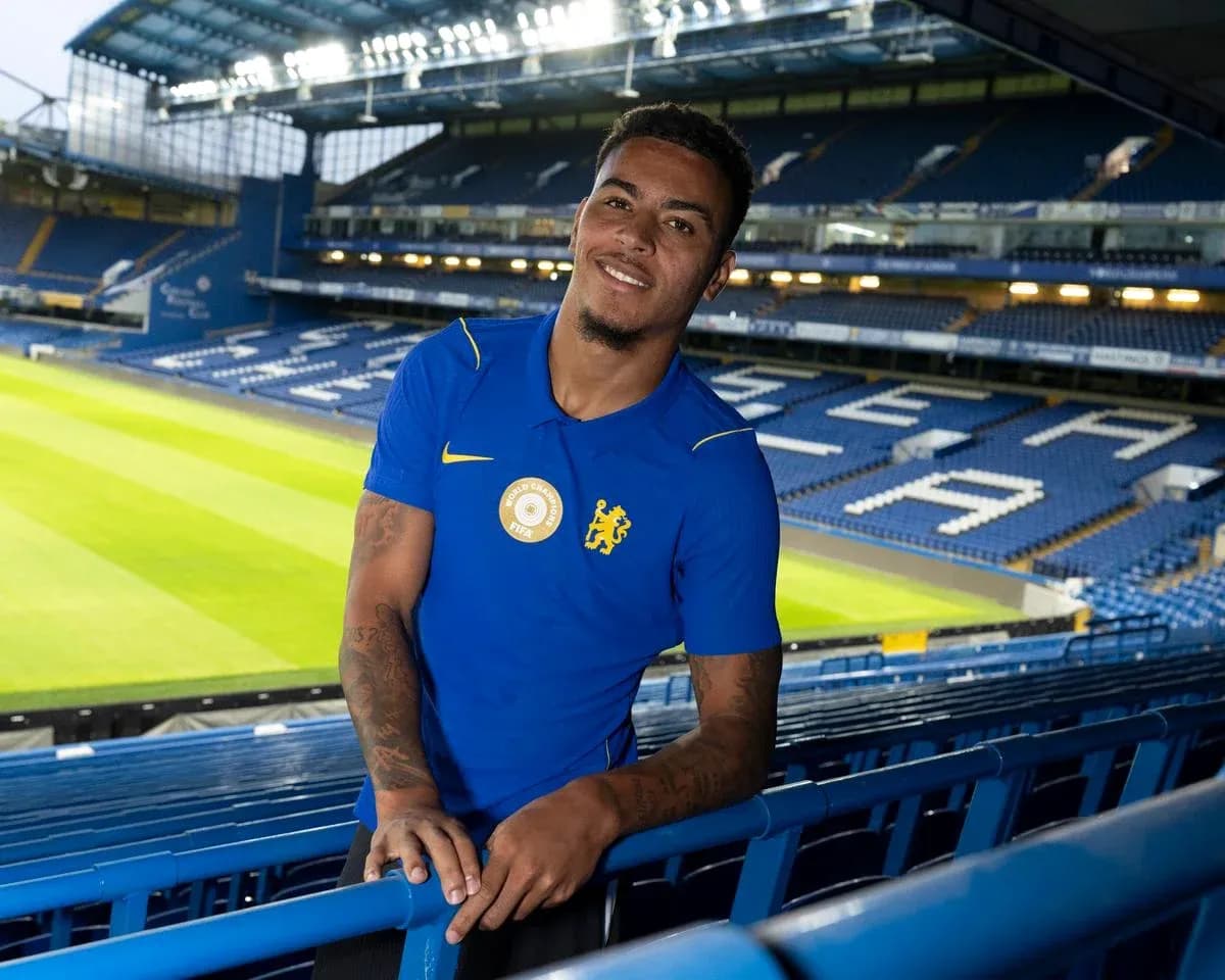 Player posing at stadium with green pitch background Player posing at stadium with green pitch background