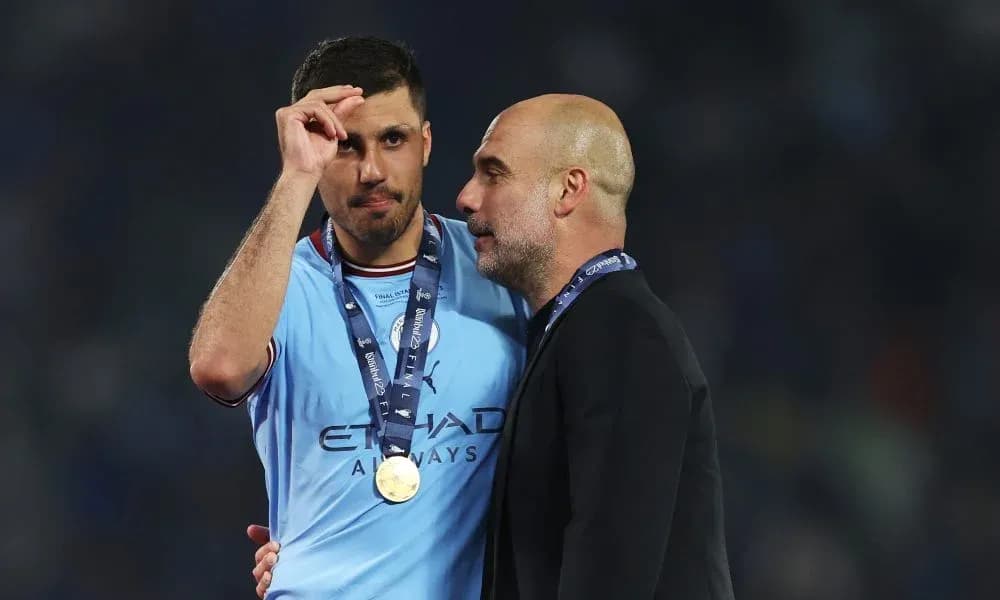 Player and manager celebrating post-match victory Player and manager celebrating post-match victory