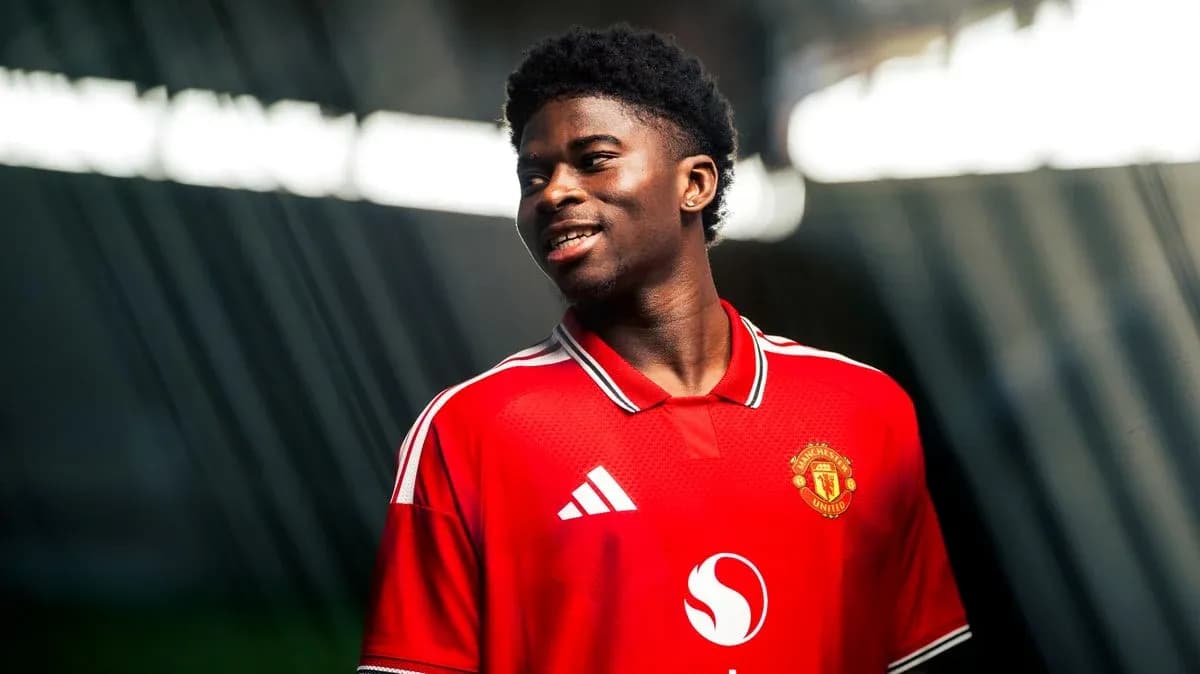 Player in Manchester United jersey smiling during photoshoot Player in Manchester United jersey smiling during photoshoot