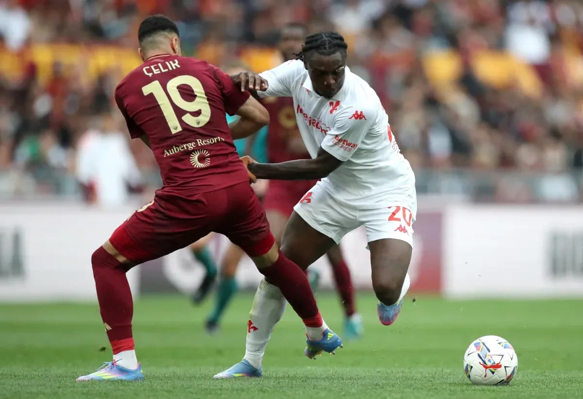 Two players competing for the ball in Serie A Two players competing for the ball in Serie A