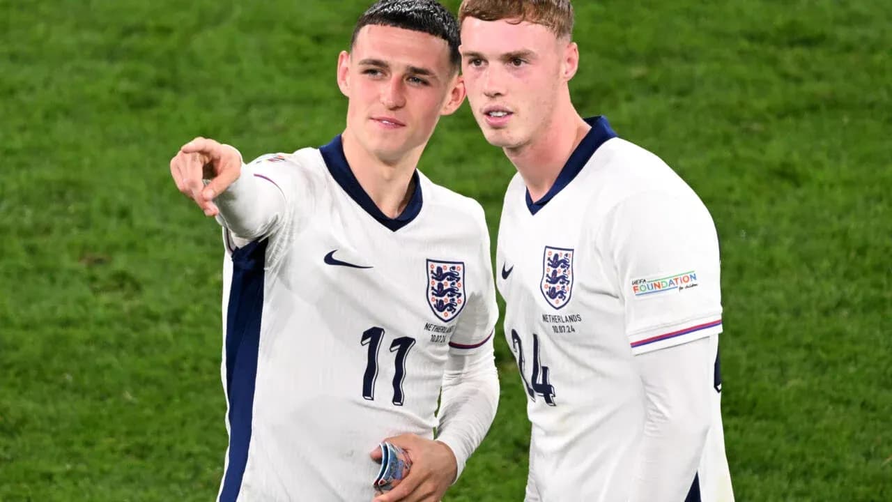 Two England players discussing on the field Two England players discussing on the field