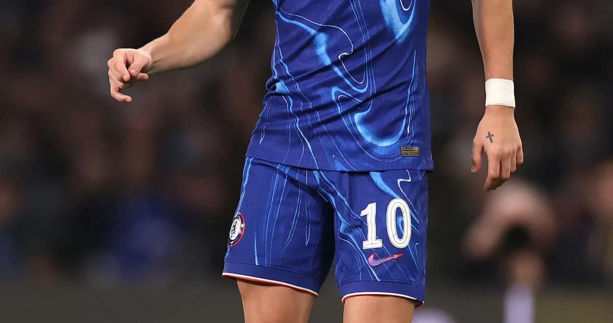Player in Chelsea kit with ball on pitch Player in Chelsea kit with ball on pitch